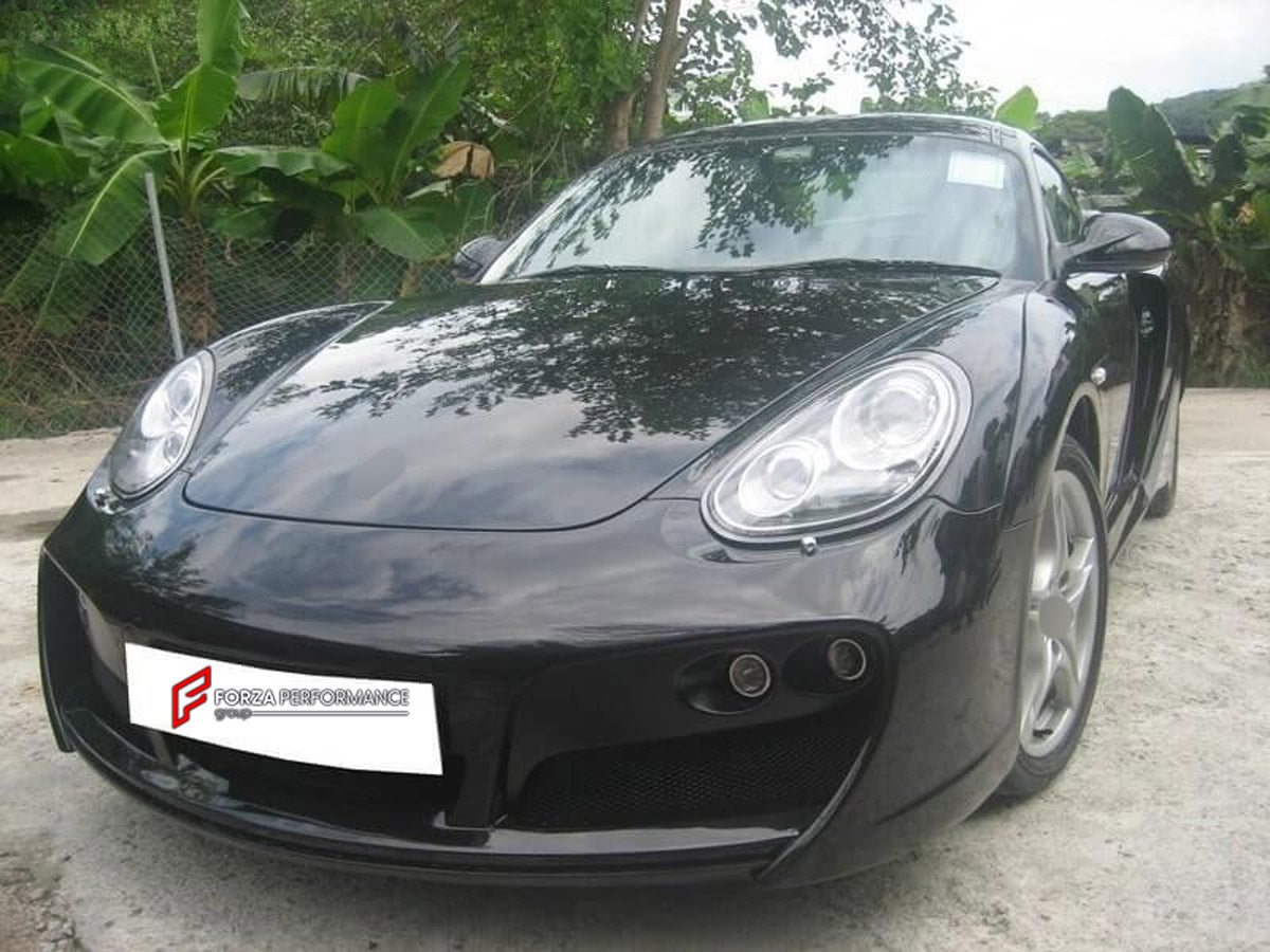 WIDE BODY KIT for Porsche Cayman 987 2009 - 2011
Set includes:

Front Bumper
Front Fender Flares
Side Skirts
Rear Fender Flares
Rear Bumper
Rear Spoiler Wing
Material: Plastic

NOTE: Professional installation is required.