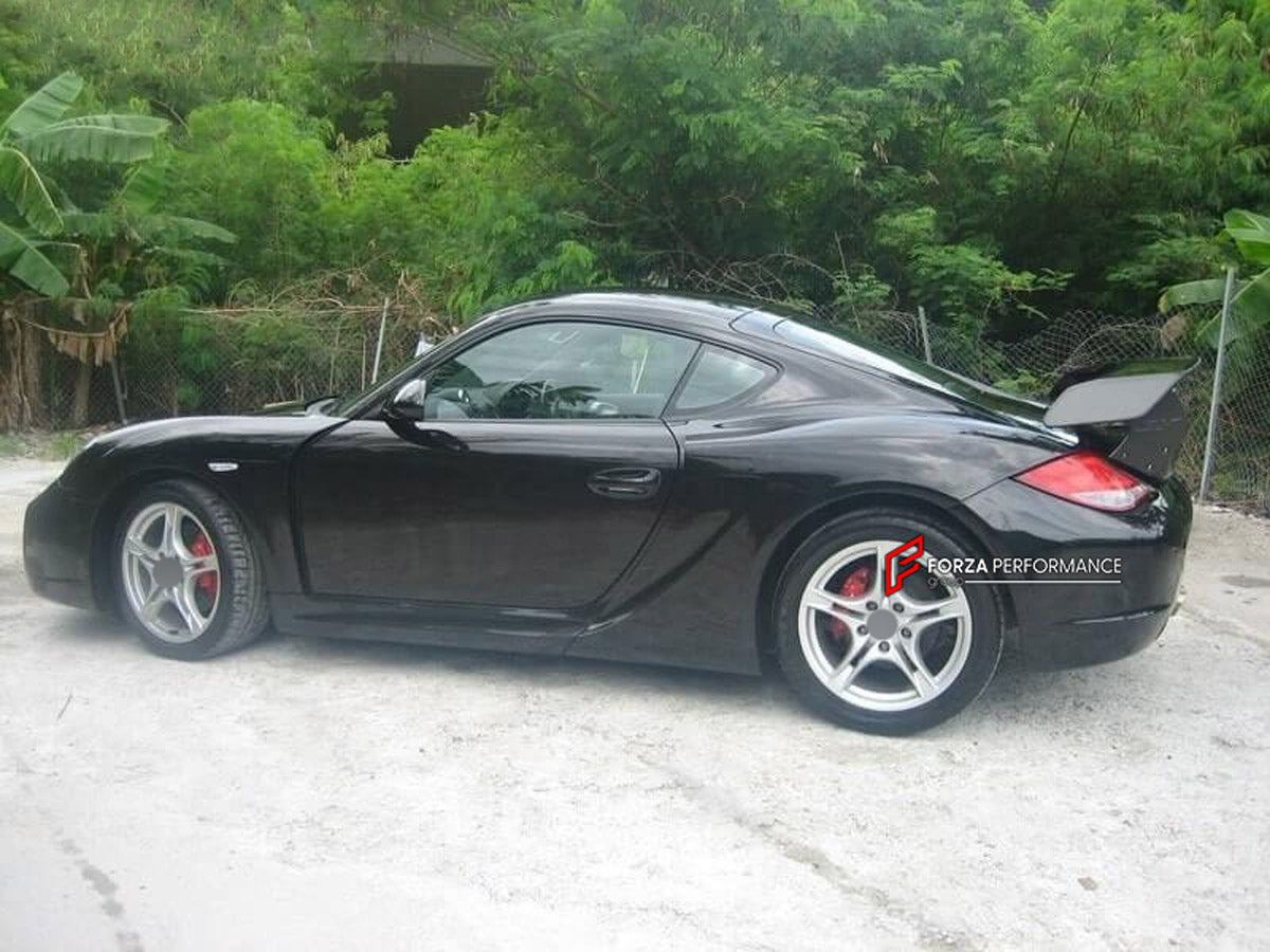 WIDE BODY KIT for Porsche Cayman 987 2009 - 2011
Set includes:

Front Bumper
Front Fender Flares
Side Skirts
Rear Fender Flares
Rear Bumper
Rear Spoiler Wing
Material: Plastic

NOTE: Professional installation is required.