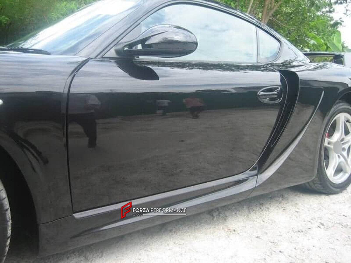 WIDE BODY KIT for Porsche Cayman 987 2009 - 2011
Set includes:

Front Bumper
Front Fender Flares
Side Skirts
Rear Fender Flares
Rear Bumper
Rear Spoiler Wing
Material: Plastic

NOTE: Professional installation is required.