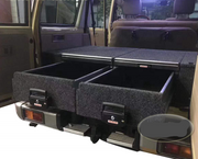 Slide Kitchen Drawer Systems For Land Cruiser 76 LC 76 by Forza Performance  Simplify the storage and organization of equipment and valuables. These lockable drawers with integrated deck and faceplates were designed specifically for the Toyota Land Cruiser 76. Hide the contents from prying eyes, while creating a more convenient and easily accessible storage space in your car. Designed solidly for tough for both on and off-road travel.