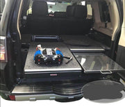 Slide Kitchen Drawer Systems For Mitsubishi Pajero by Forza Performance  Simplify the storage and organization of equipment and valuables. These lockable drawers with integrated deck and faceplates were designed specifically for the Mitsubishi Pajero. Hide the contents from prying eyes, while creating a more convenient and easily accessible storage space in your car. Designed solidly for tough for both on and off-road travel.
