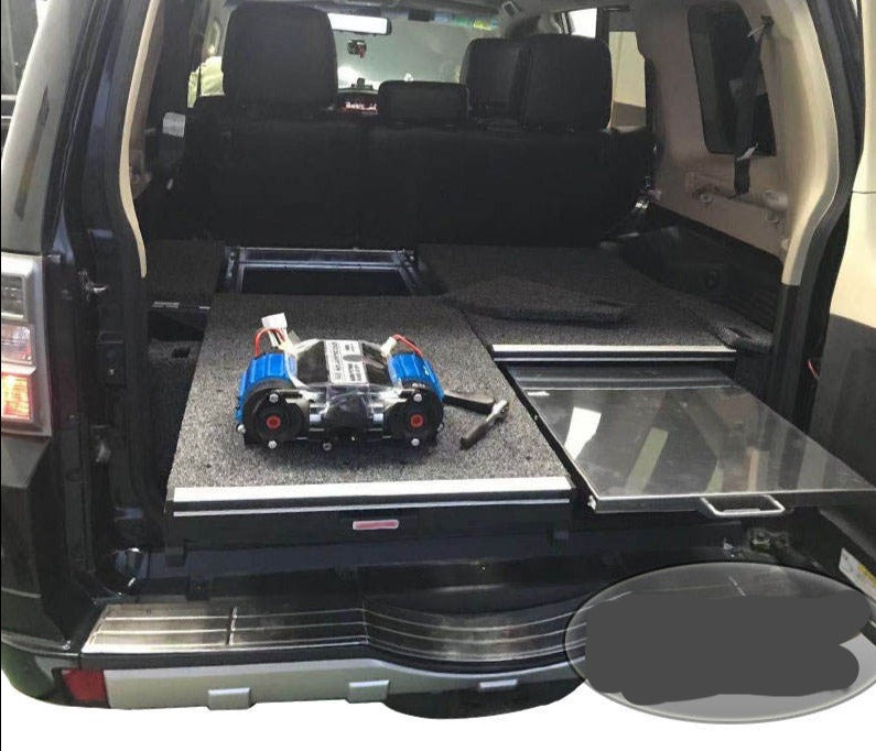 Slide Kitchen Drawer Systems For Mitsubishi Pajero by Forza Performance  Simplify the storage and organization of equipment and valuables. These lockable drawers with integrated deck and faceplates were designed specifically for the Mitsubishi Pajero. Hide the contents from prying eyes, while creating a more convenient and easily accessible storage space in your car. Designed solidly for tough for both on and off-road travel.