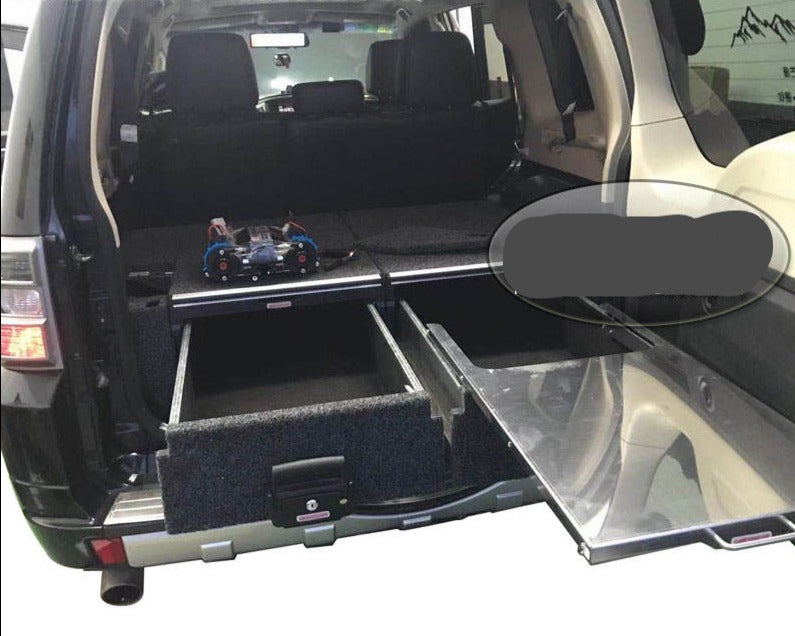 Slide Kitchen Drawer Systems For Mitsubishi Pajero by Forza Performance  Simplify the storage and organization of equipment and valuables. These lockable drawers with integrated deck and faceplates were designed specifically for the Mitsubishi Pajero. Hide the contents from prying eyes, while creating a more convenient and easily accessible storage space in your car. Designed solidly for tough for both on and off-road travel.