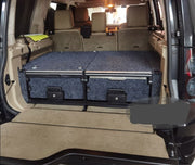 Slide Kitchen Drawer Systems For Land Rover Discovery 4 by Forza Performance  Simplify the storage and organization of equipment and valuables. These lockable drawers with integrated deck and faceplates were designed specifically for the Land Rover Discovery 4. Hide the contents from prying eyes, while creating a more convenient and easily accessible storage space in your car. Designed solidly for tough for both on and off-road travel.