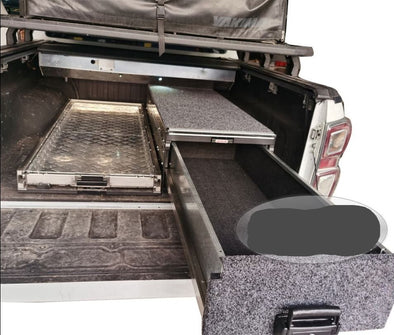 Slide Kitchen Drawer Systems For Toyota Hilux by Forza Performance  Simplify the storage and organization of equipment and valuables. These lockable drawers with integrated deck and faceplates were designed specifically for the Toyota Hilux. Hide the contents from prying eyes, while creating a more convenient and easily accessible storage space in your car. Designed solidly for tough for both on and off-road travel.