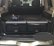 Slide Kitchen Drawer Systems For Mitsubishi Pajero by Forza Performance  Simplify the storage and organization of equipment and valuables. These lockable drawers with integrated deck and faceplates were designed specifically for the Mitsubishi Pajero. Hide the contents from prying eyes, while creating a more convenient and easily accessible storage space in your car. Designed solidly for tough for both on and off-road travel.