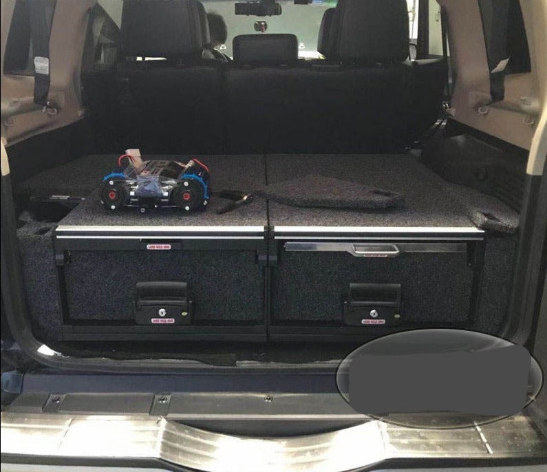 Slide Kitchen Drawer Systems For Mitsubishi Pajero by Forza Performance  Simplify the storage and organization of equipment and valuables. These lockable drawers with integrated deck and faceplates were designed specifically for the Mitsubishi Pajero. Hide the contents from prying eyes, while creating a more convenient and easily accessible storage space in your car. Designed solidly for tough for both on and off-road travel.