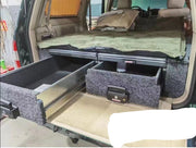 Slide Kitchen Drawer Systems For Land Cruiser 100 LC 100 by Forza Performance  Simplify the storage and organization of equipment and valuables. These lockable drawers with integrated deck and faceplates were designed specifically for the Toyota Land Cruiser 100. Hide the contents from prying eyes, while creating a more convenient and easily accessible storage space in your car. Designed solidly for tough for both on and off-road travel.