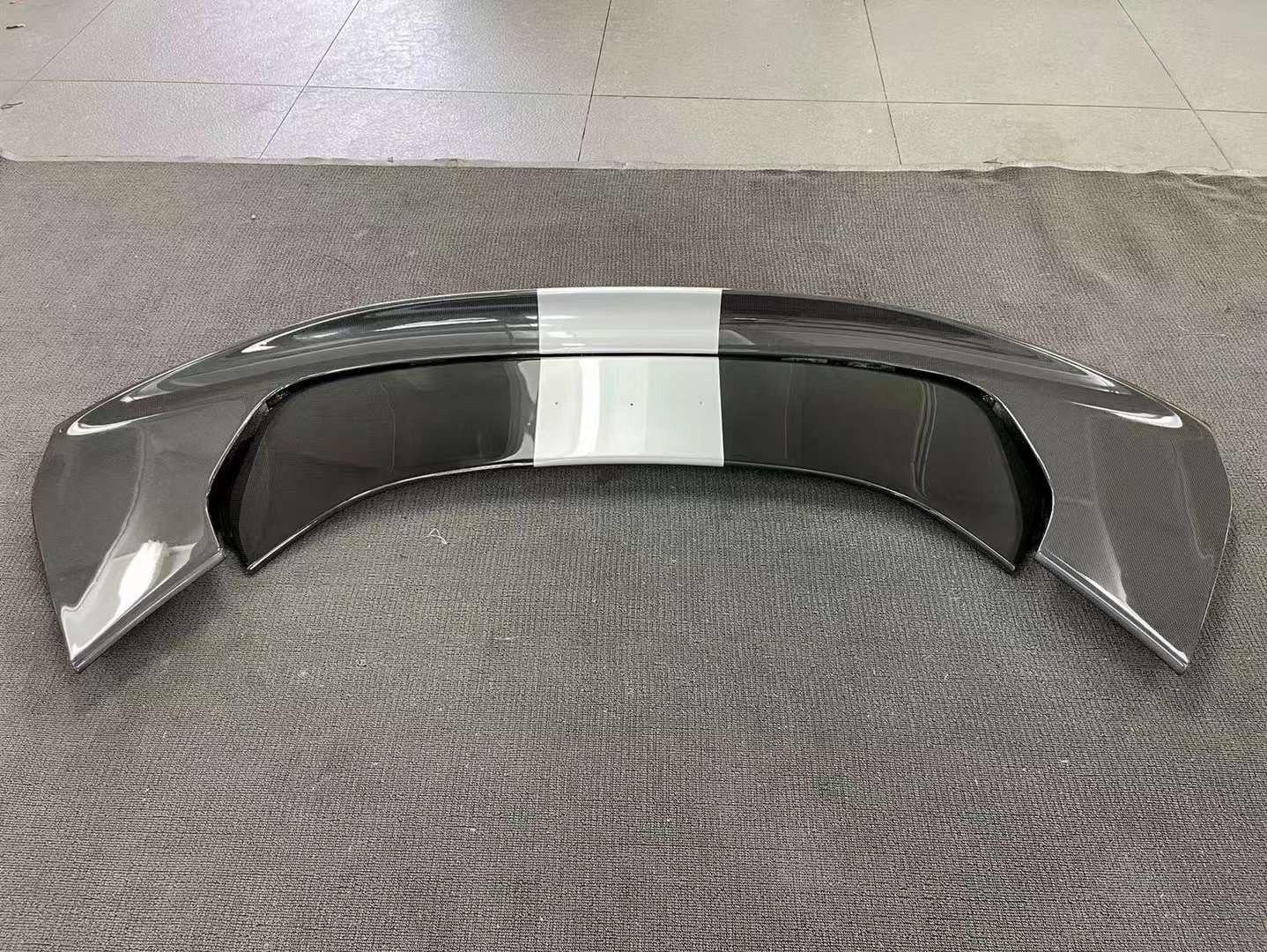 CARBON OEM GENUINE PARTS for FERRARI SF90 2021+  Set includes:  Front Lip Front Trims Side Skirts Side Vents Rear Diffuser Rear Spoiler Wing Material: Carbon Fiber  NOTE: Professional installation is required.  Contact us for pricing
