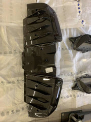 CARBON OEM GENUINE PARTS for FERRARI SF90 2021+  Set includes:  Front Lip Front Trims Side Skirts Side Vents Rear Diffuser Rear Spoiler Wing Material: Carbon Fiber  NOTE: Professional installation is required.  Contact us for pricing