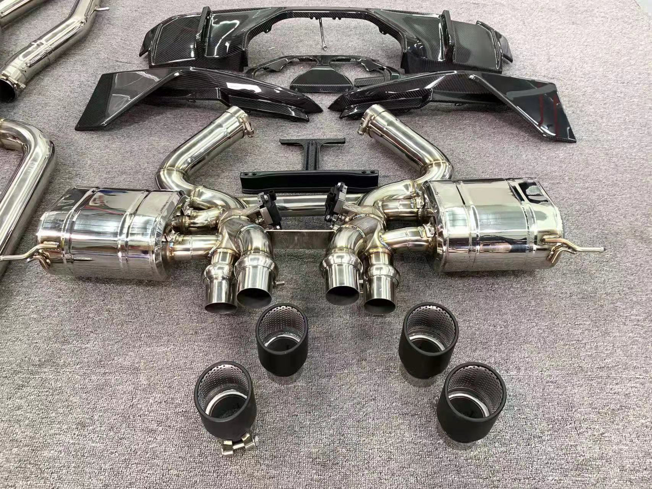Aggressive sporty sound VALVED EXHAUST CATBACK MUFFLER with exhaust tips for BMW M3 G80 M4 G82 2021+ (Engine:3.0)  Valved exhaust, meaning that has remote, controlled valves - allowing a switch between an aggressive loud sports sound and a sound that is closer to the OEM sound  Set include:   Front pipes Center pipes Mufflers with valves Exhaust tips Material: Stainless steel 304