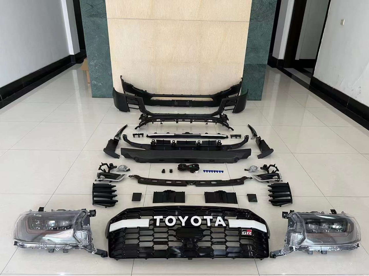 GR FACELIFT BODY KIT FOR LAND CRUISER 300 LC 300  Set include:  Front Bumper Assembly  Grille Material: Plastic  NOTE: Professional installation is required.