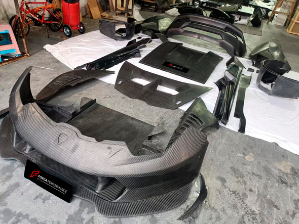 Carbon replacement BODY KIT for Lamborghini Huracan LP 620-2 2013 - 2016  Set include: Front bumper Front lip Front hood Side skirts  Rear bumper Rear diffuser Rear Spoiler Material: DRY CARBON FIBER