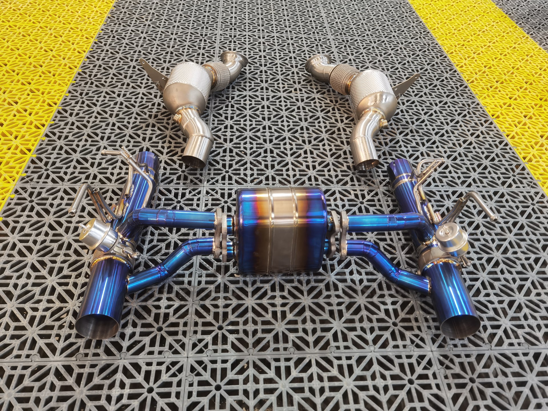 Aggressive Sporty Sound Valved Exhaust System with Mufflers for Ferrari F8 Tributo 2019 - 2023 (3.9)  Set include:  Mufflers - Catback Valves Downpipes Material: Stainless steel ( for an extra cost we can make titanium )  Optional: We can offer downpipe and catless downpipe   Production time: 20-25 days