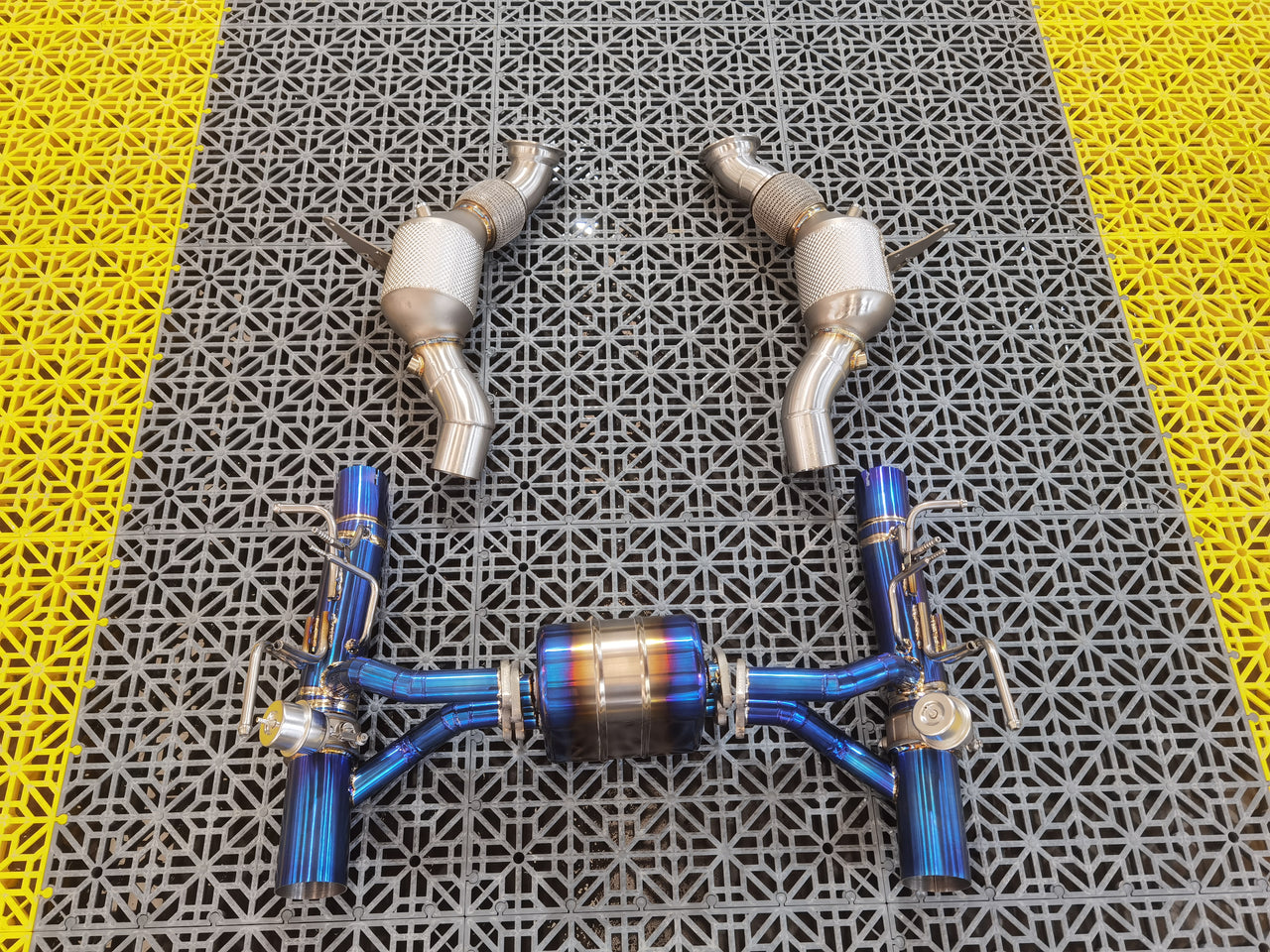 Aggressive Sporty Sound Valved Exhaust System with Mufflers for Ferrari F8 Tributo 2019 - 2023 (3.9)  Set include:  Mufflers - Catback Valves Downpipes Material: Stainless steel ( for an extra cost we can make titanium )  Optional: We can offer downpipe and catless downpipe   Production time: 20-25 days