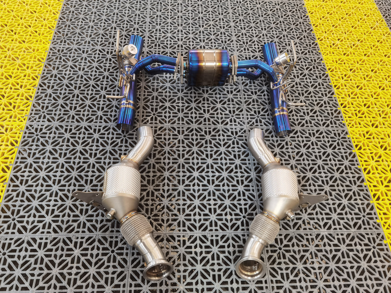 Aggressive Sporty Sound Valved Exhaust System with Mufflers for Ferrari F8 Tributo 2019 - 2023 (3.9)  Set include:  Mufflers - Catback Valves Downpipes Material: Stainless steel ( for an extra cost we can make titanium )  Optional: We can offer downpipe and catless downpipe   Production time: 20-25 days