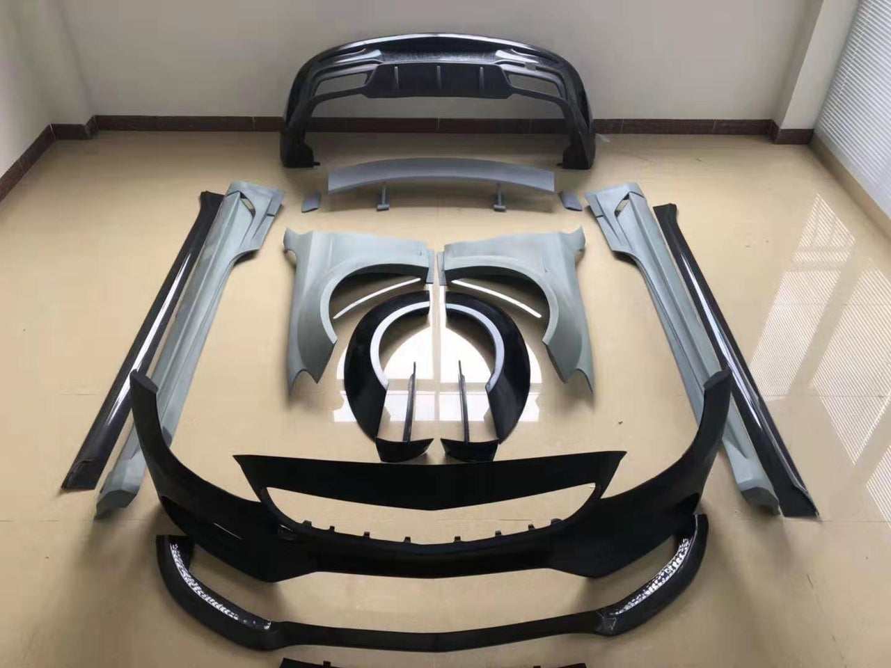 WIDE BODY KIT for MERCEDES BENZ C CLASS W205 C63 2015 - 2021

Set includes:

Front Bumper
Front Lip
Side Skirts
Fender Flares
Rear Bumper
Rear Spoiler

Material: Carbon Fiber

Note: Only fits the original C63. Professional installation is required
